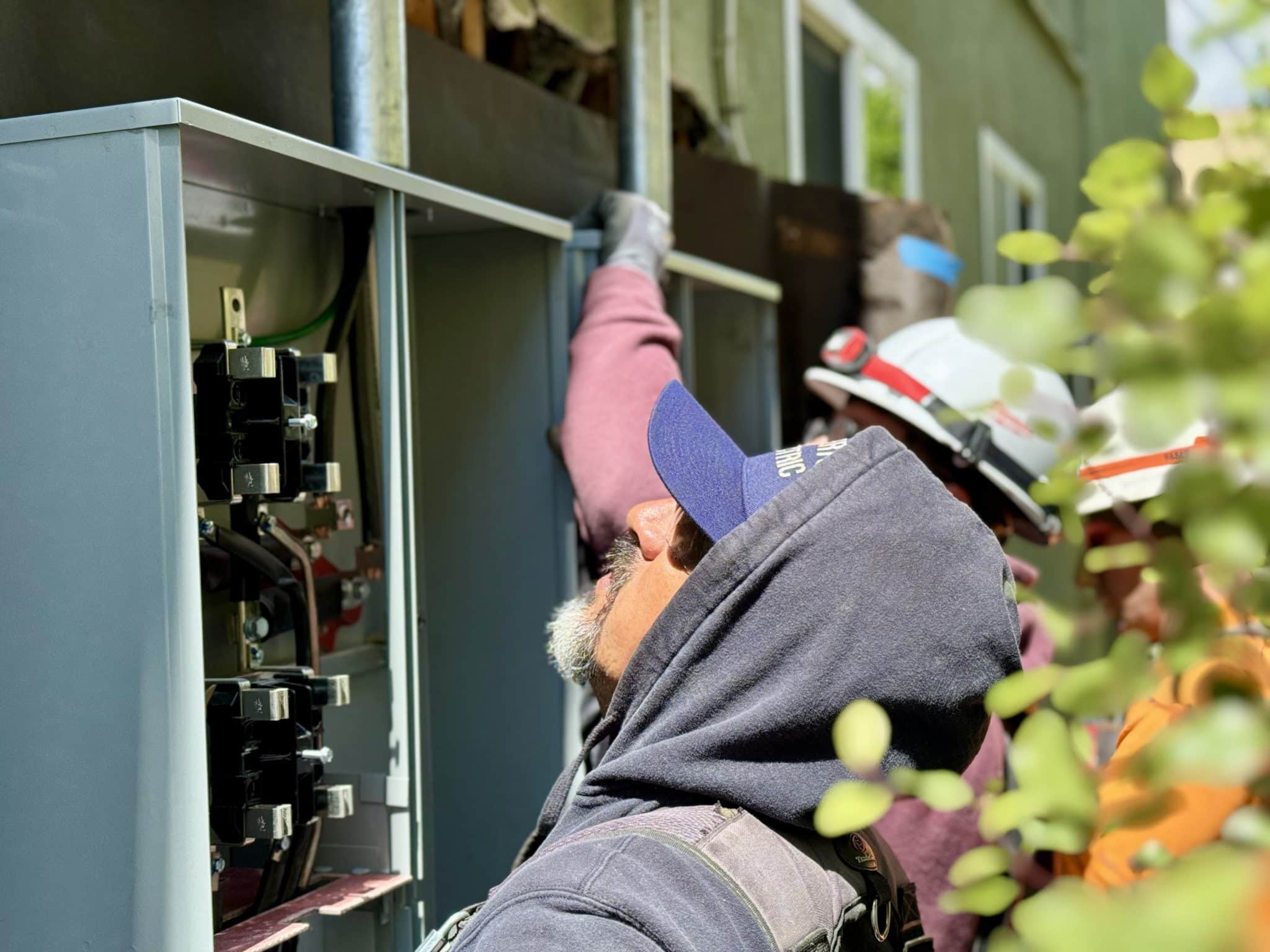 Technician working on electrical panel